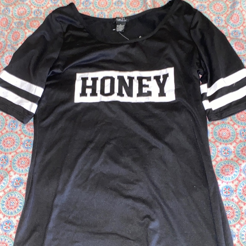 A graphic tee with half sleeves that can be worn as a dress or worn with pants.
